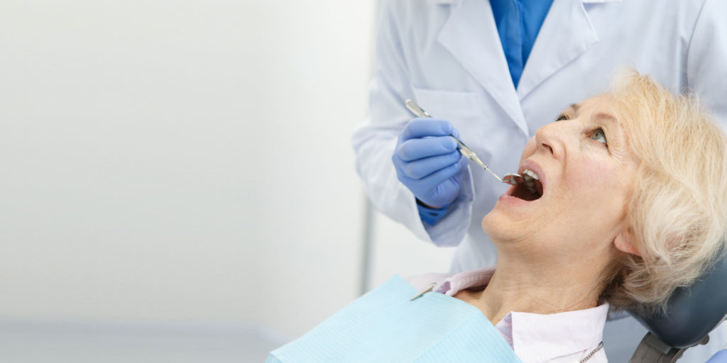 dental patient undergoing oral pathology exam