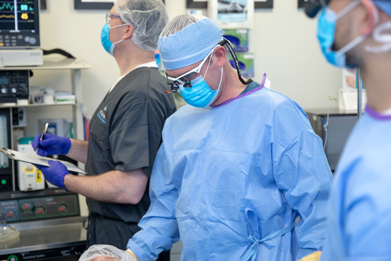 oral surgeon performing procedure